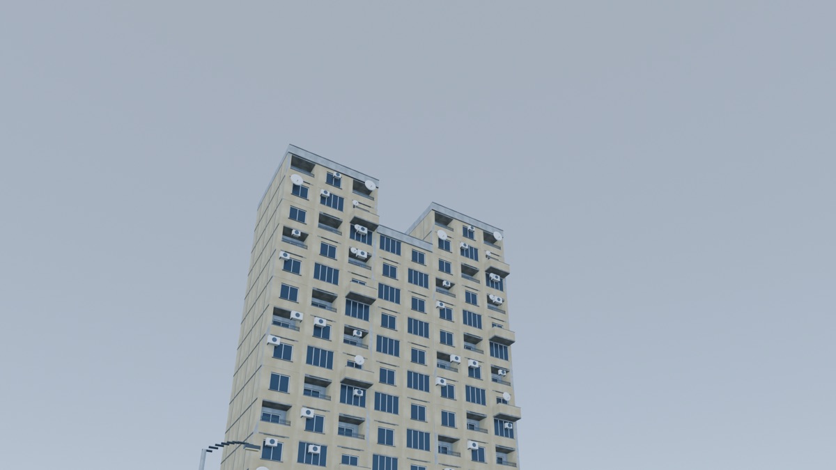 Two tall panel-block towers joined by a multi-storey sky bridge over an open ground-level passage.